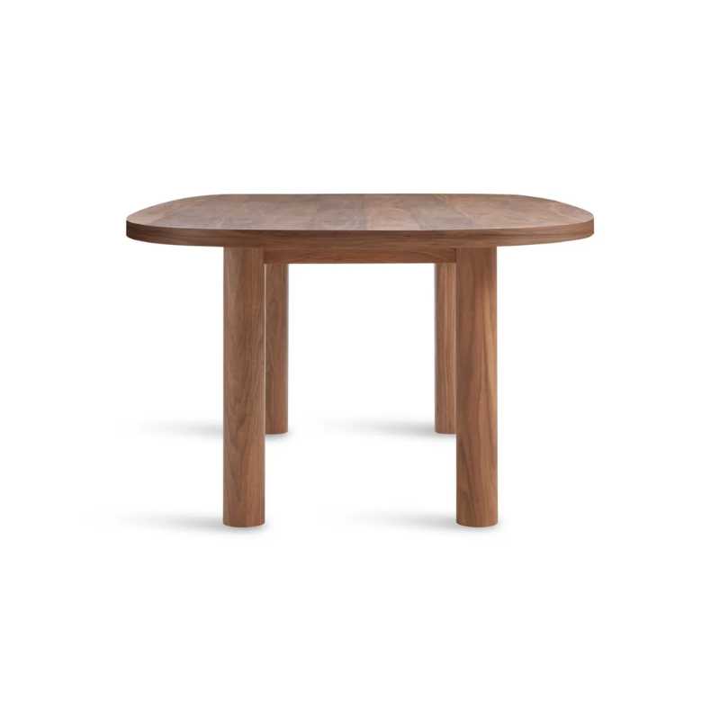 The 100 inch Good Times Dining Table from Blu Dot in walnut from the side.