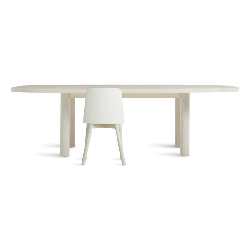 The 100 inch Good Times Dining Table from Blu Dot in whitewashed ash in a studio.