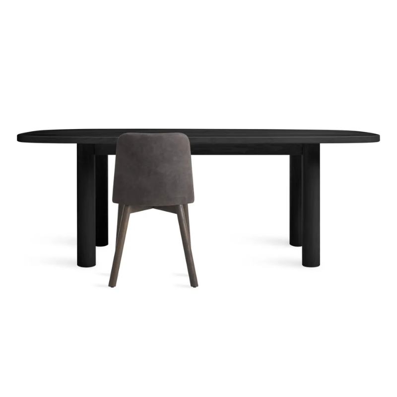 The 82 inch Good Times Dining Table from Blu Dot in black on ash in a studio.