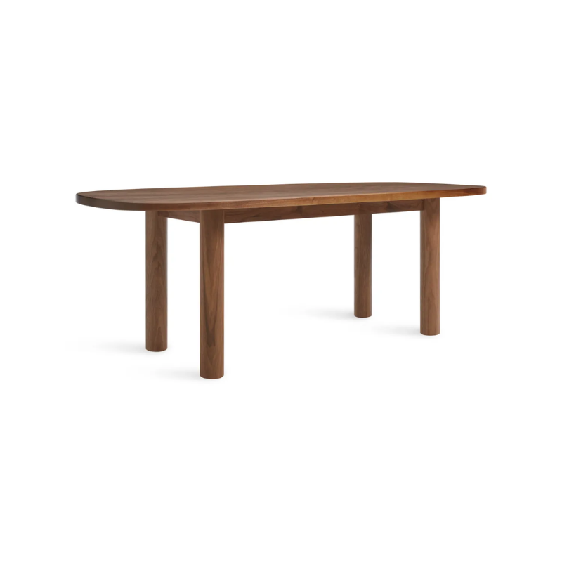 The 82 inch Good Times Dining Table from Blu Dot in walnut from an angle.