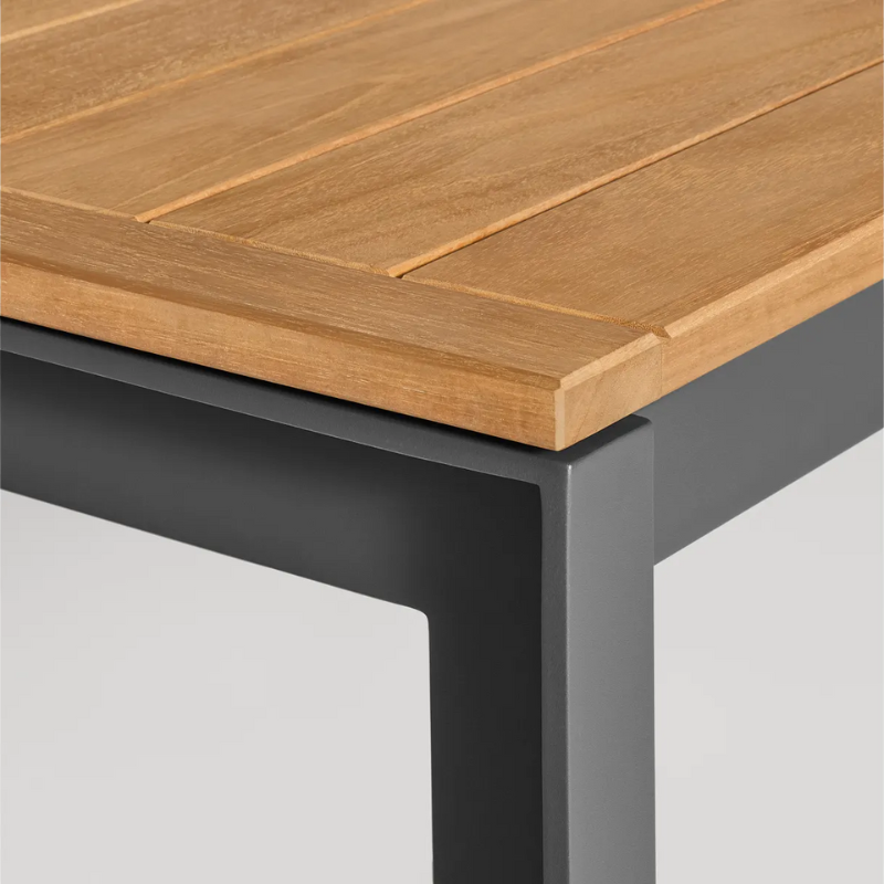 The Hold Tight 76" Outdoor Dining Table from Blu Dot in carbon and teak corner.