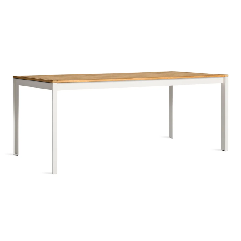 The Hold Tight 76" Outdoor Dining Table from Blu Dot in white and teak from an angle.