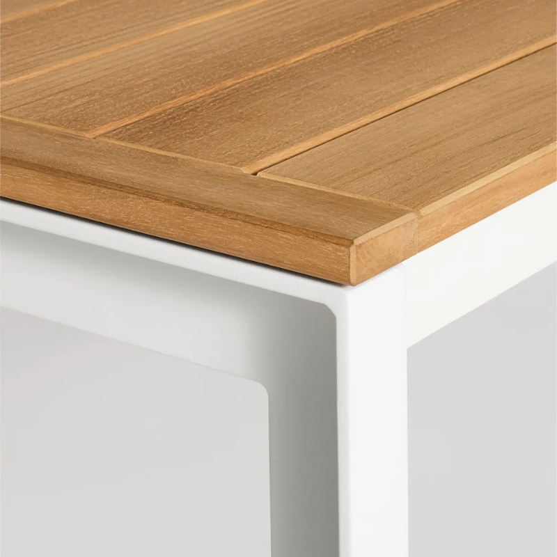 The Hold Tight 76" Outdoor Dining Table from Blu Dot in white and teak corner.