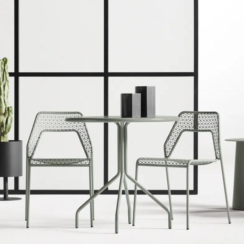 The Hot Mesh 30" Café Table from Blu Dot in a living room.