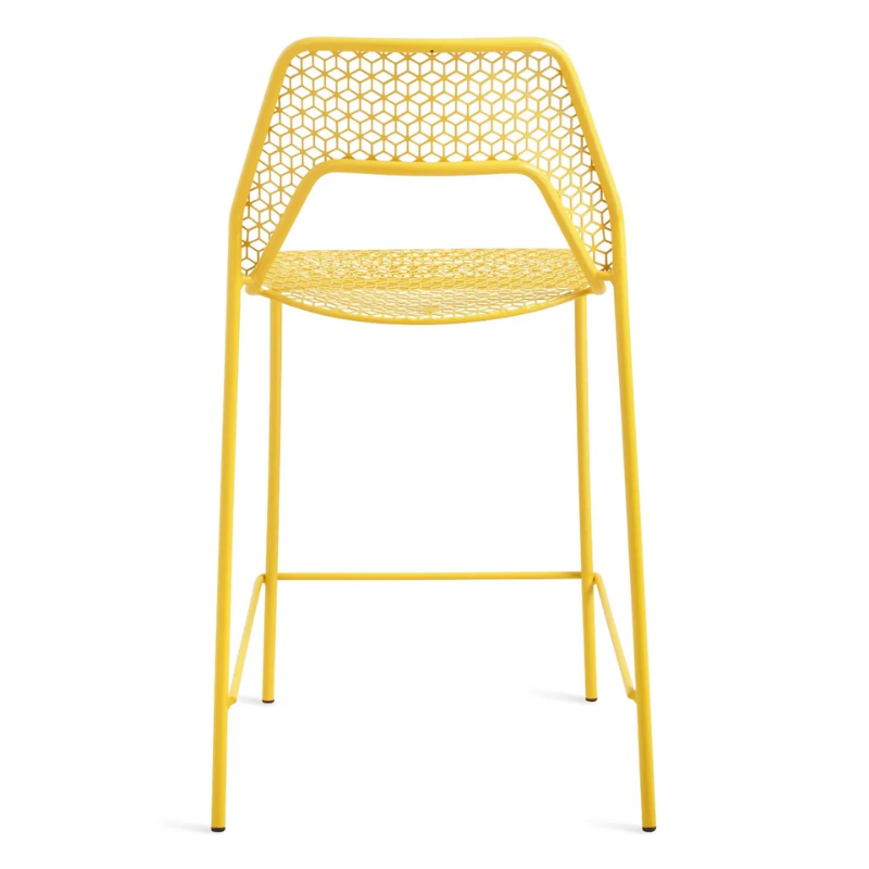 The Hot Mesh Counter Stool from Blu Dot in natural yellow from the back.
