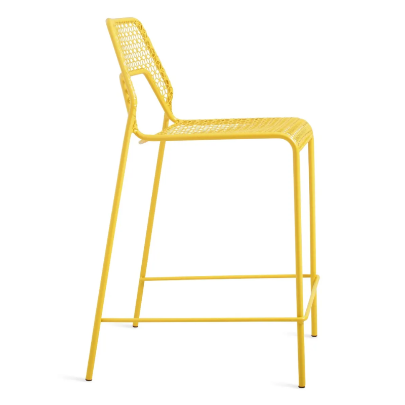 The Hot Mesh Counter Stool from Blu Dot in natural yellow from the side.