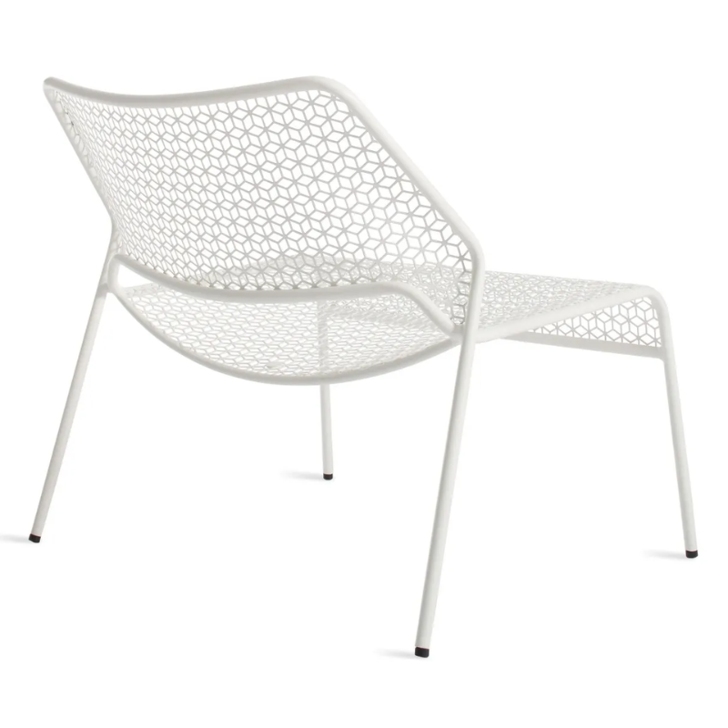 The Hot Mesh Lounge Chair from Blu Dot in off white from the back at an angle.