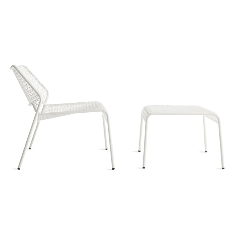 The Hot Mesh Lounge Chair from Blu Dot in off white with the hot mesh ottoman from the side.