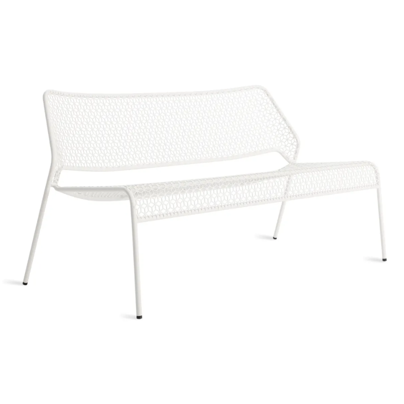 The Hot Mesh Settee from Blu Dot in white from an angle.