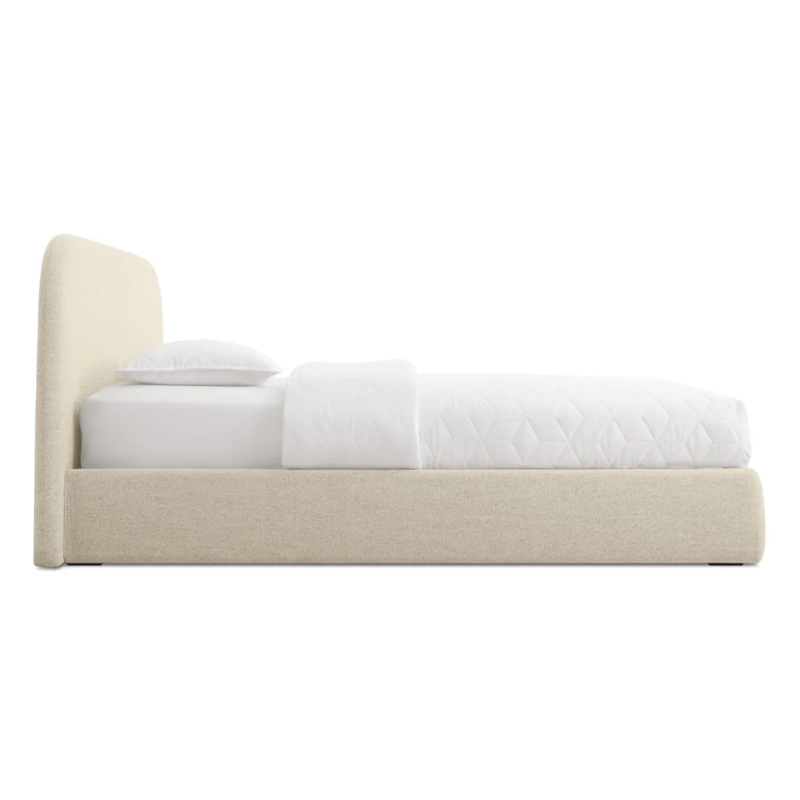 The king size Lid Bed from Blu Dot in tait beach upholstery from the side.