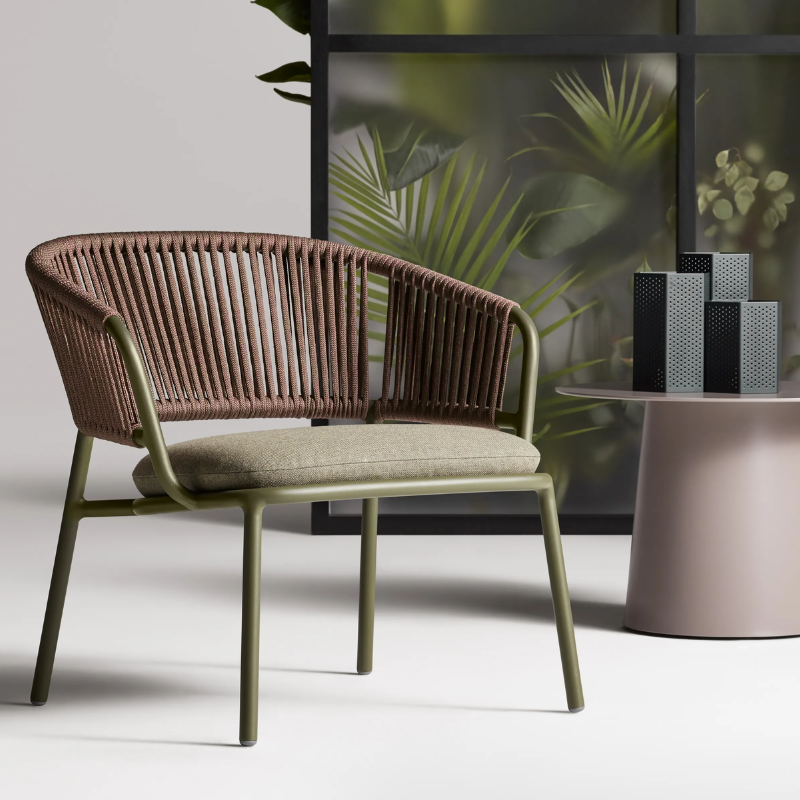 The Mate Outdoor Lounge Chair from Blu Dot in a living room.