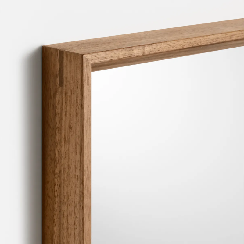 The Mode Small Mirror from Blu Dot in walnut corner.