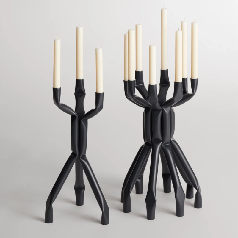 The Nosferatube Large Candelabra from Blu Dot in the black collection in a family room.