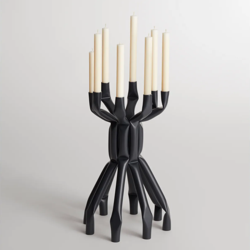 The Nosferatube Large Candelabra from Blu Dot in black in a living room studio.