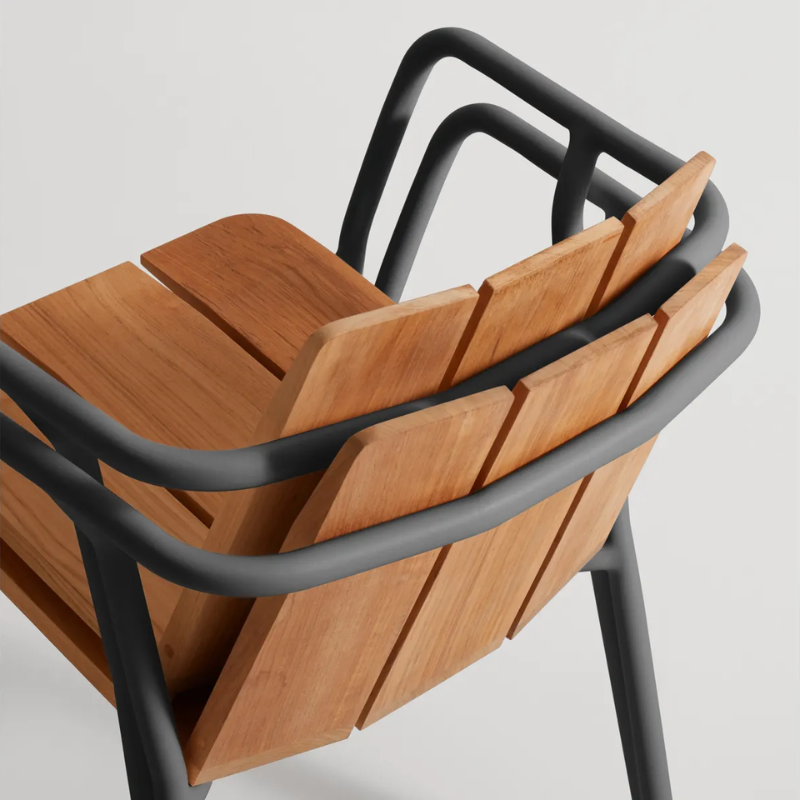 The Offline Outdoor Chair from Blu Dot in carbon showing the stackable option from the back.