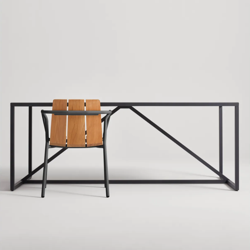 The Offline Outdoor Chair from Blu Dot in carbon in a studio.