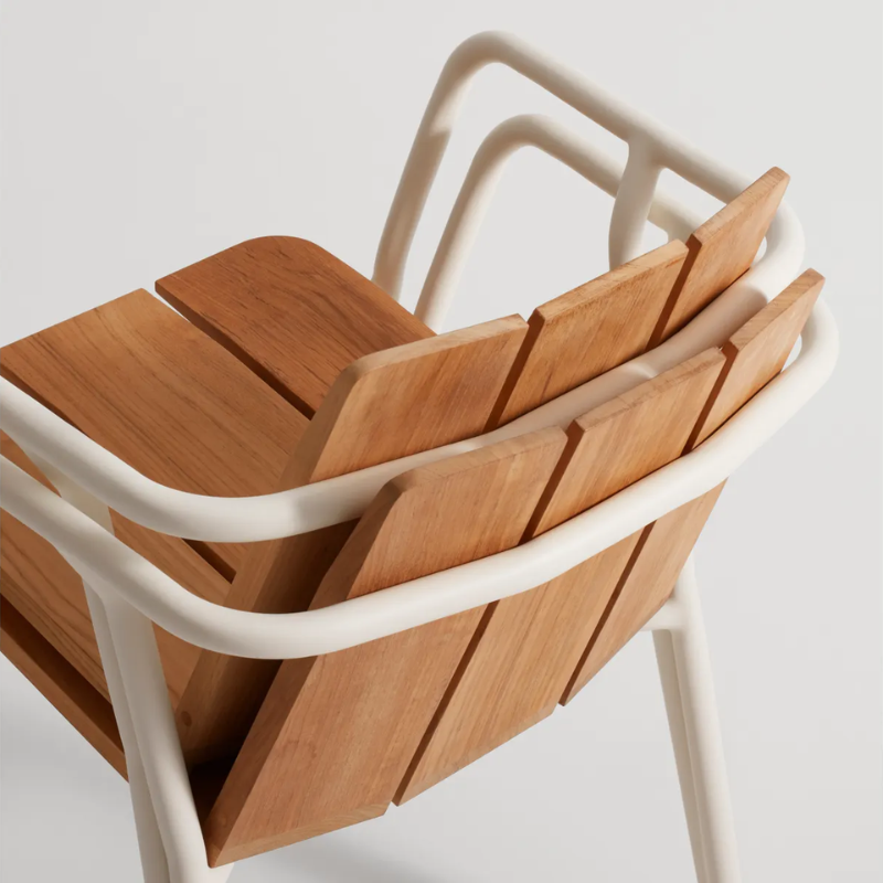 The Offline Outdoor Chair from Blu Dot in white stacked from the back.