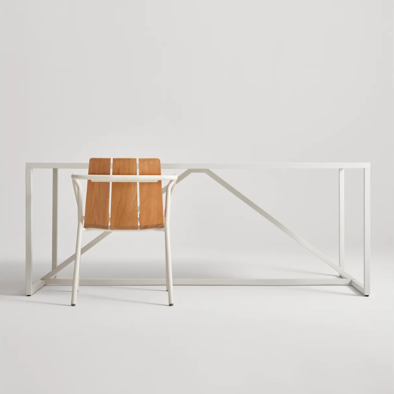 The Offline Outdoor Chair from Blu Dot in white in a studio.