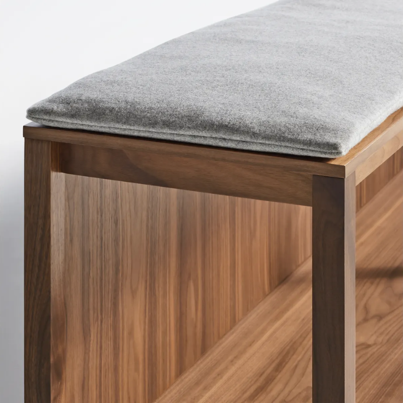 The Open Plan Bench Pad from Blu Dot with gabro light grey fabric upholstery close up.