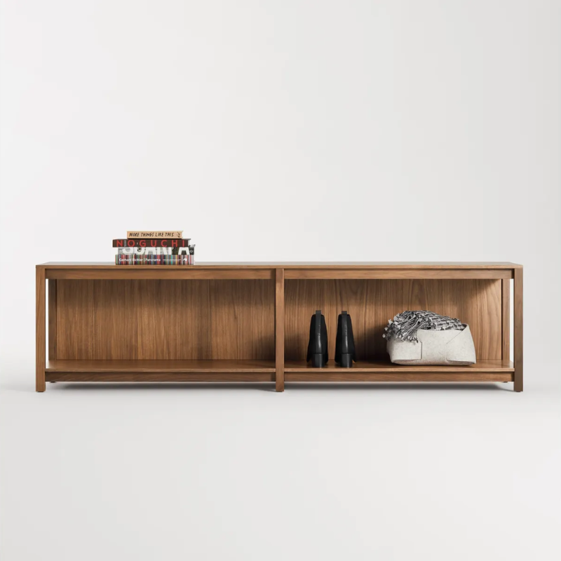 The Open Plan Bench from Blu Dot in walnut in a living room.