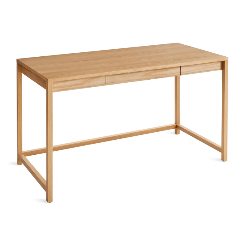 The large Open Plan Desk from Blu Dot in white oak from an angle looking at the top.