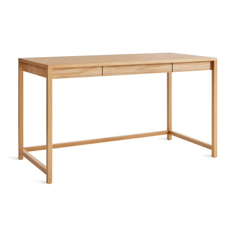The large Open Plan Desk from Blu Dot in white oak from an angle.