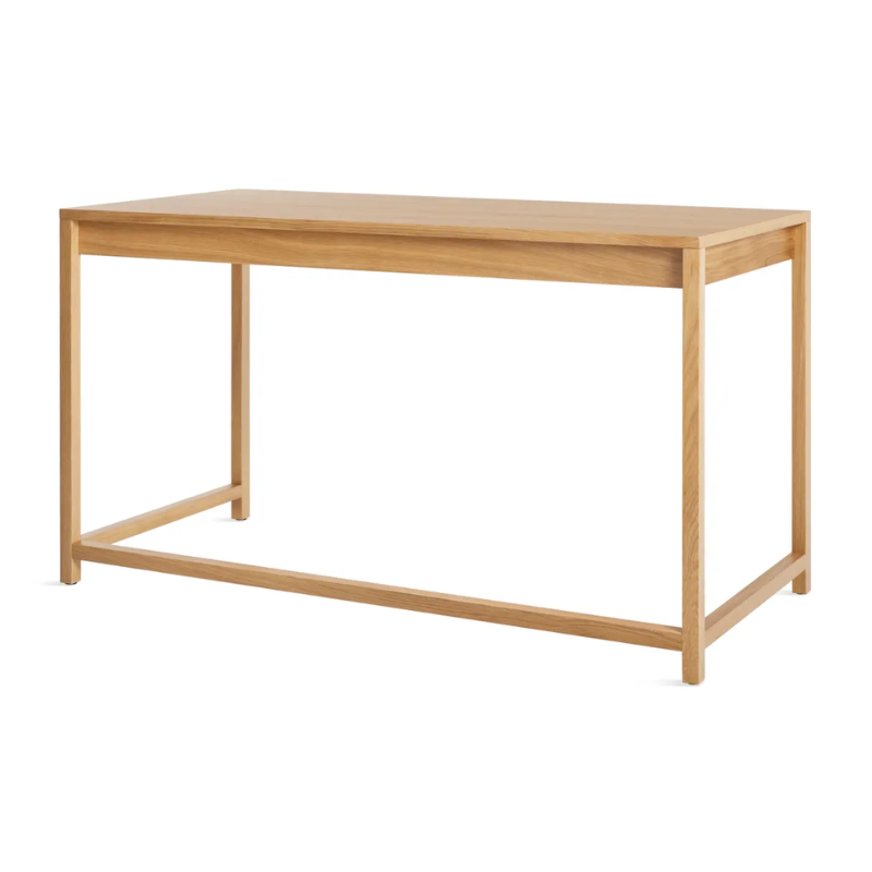 The large Open Plan Desk from Blu Dot in white oak from the back at an angle.