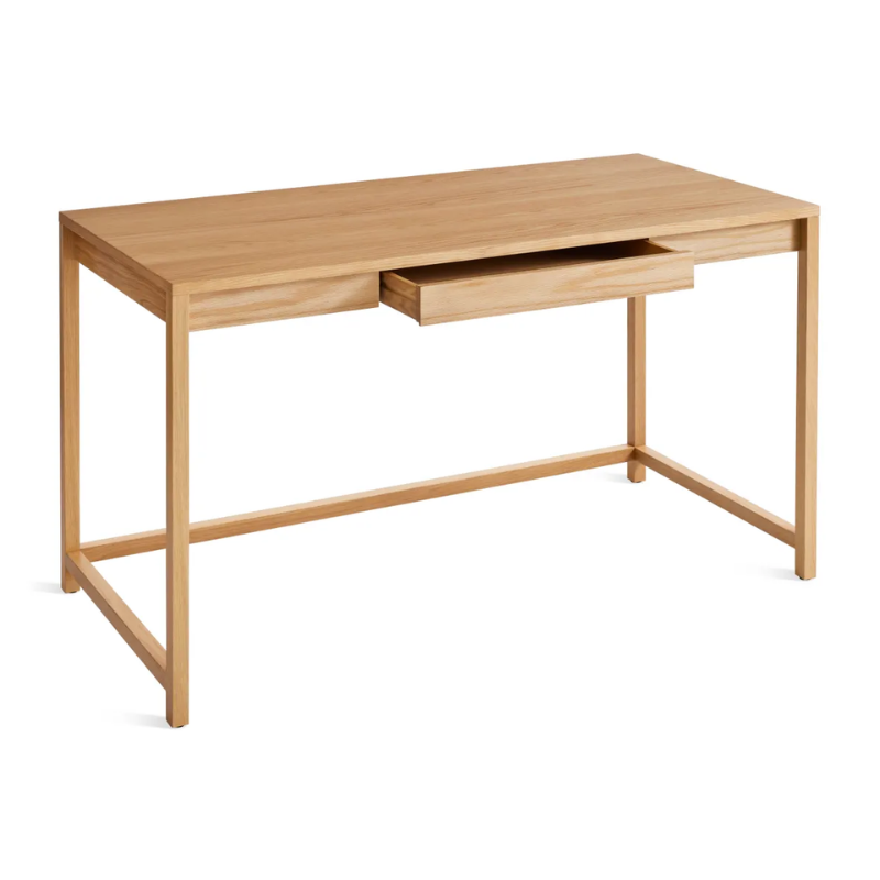 The large Open Plan Desk from Blu Dot in white oak with an open drawer from a high angle.