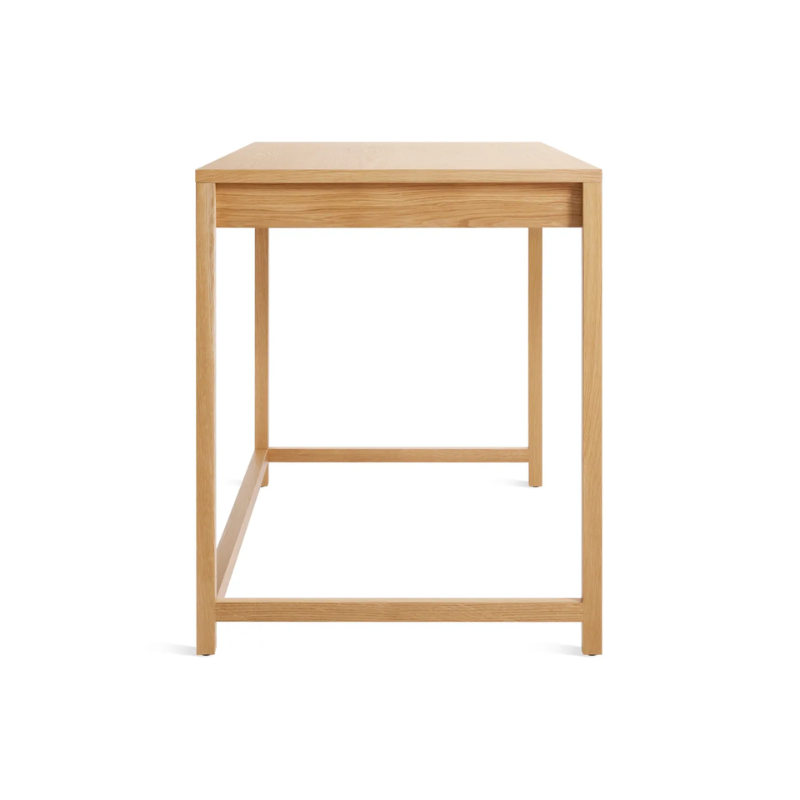 The large Open Plan Desk from Blu Dot in white oak from the side.