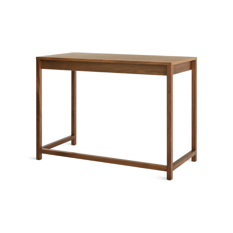 The small Open Plan Desk from Blu Dot in walnut from a back angle.