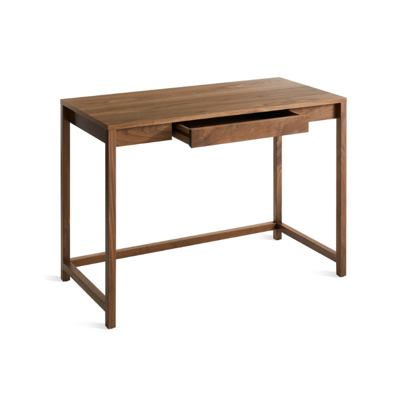 The small Open Plan Desk from Blu Dot in walnut with an open drawer from a high angle.