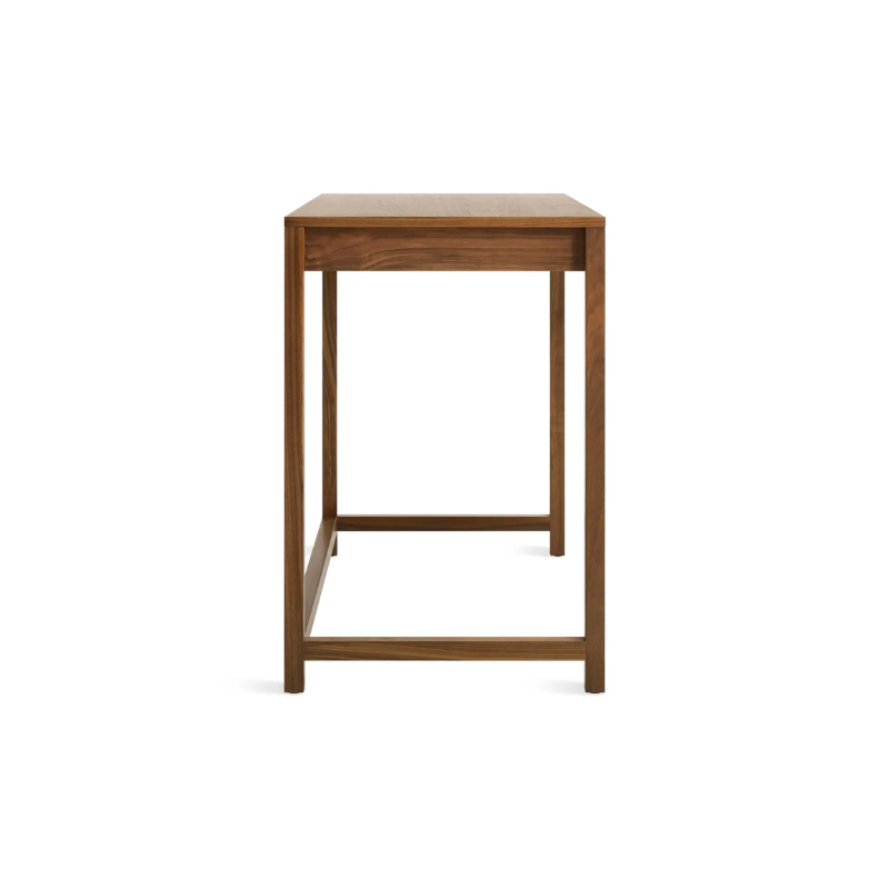 The small Open Plan Desk from Blu Dot in walnut from the side.