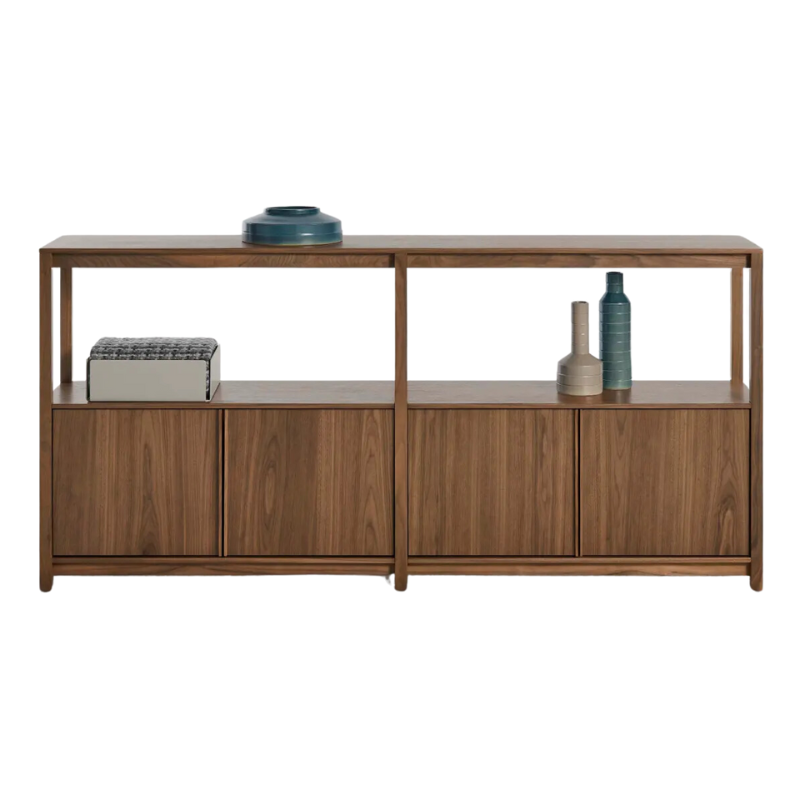 The Open Plan Large Low Bookcase with Storage from Blu Dot in walnut in a studio.