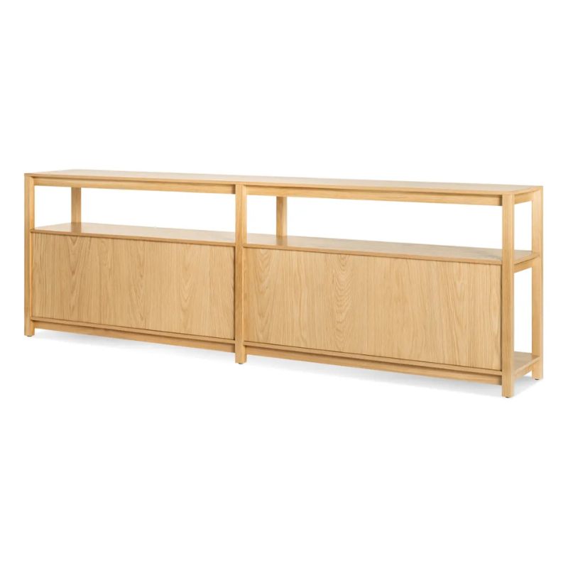The Open Plan Long and Low Bookcase from Blu Dot in white oak from the back at an angle.