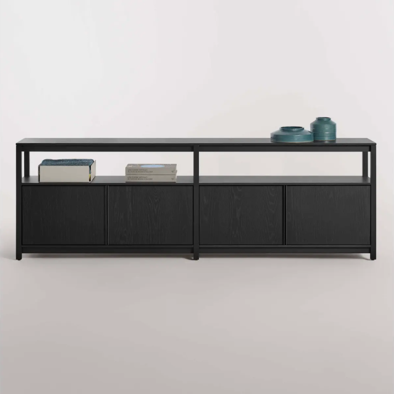 The Open Plan Long and Low Bookcase with Storage from Blu Dot in a studio.