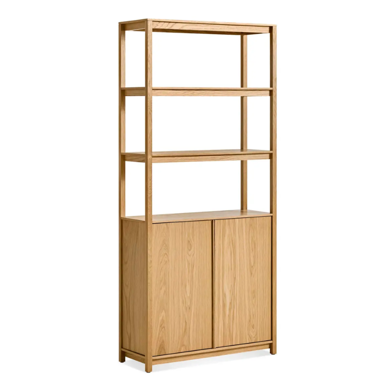 The Open Plan Tall Bookcase with Storage from Blu Dot in white oak from an angle.