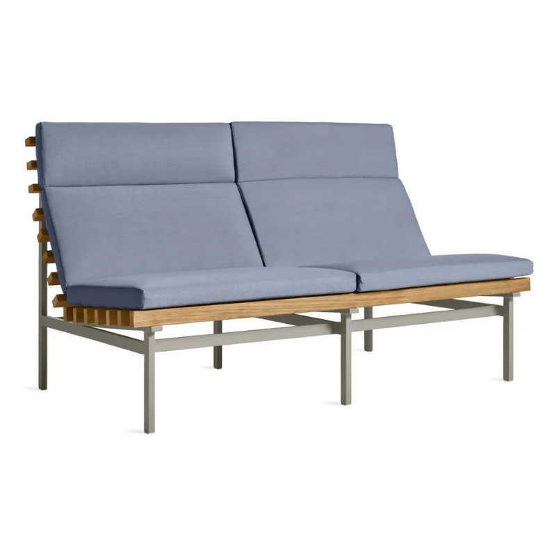The Perch Outdoor 2 Seat Sofa from Blu Dot with charcoal frame and sunbrella haze upholstery from an angle.