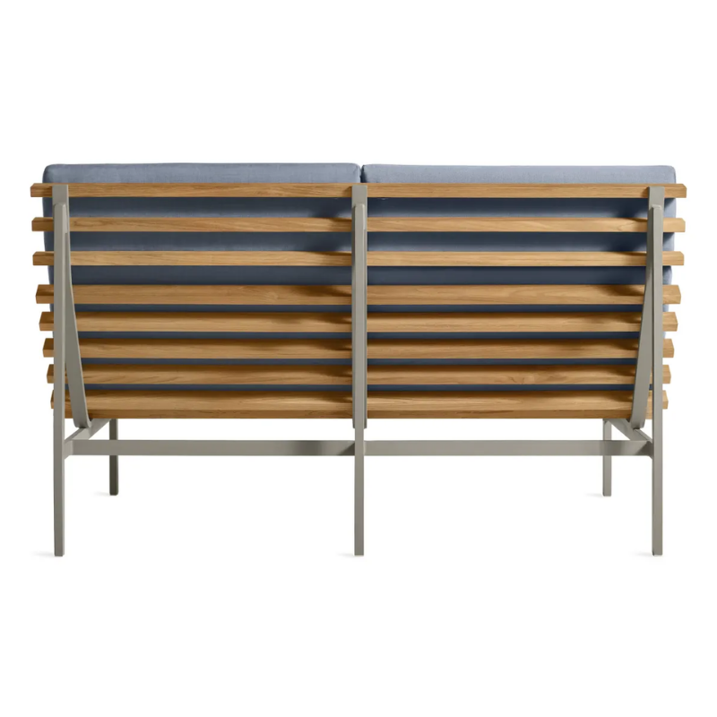 The Perch Outdoor 2 Seat Sofa from Blu Dot with charcoal frame and sunbrella haze upholstery from the back.