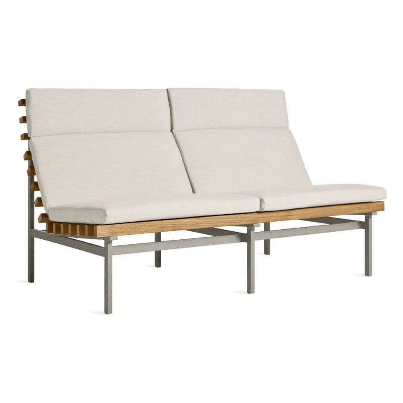 The Perch Outdoor 2 Seat Sofa from Blu Dot with charcoal frame and sunbrella linen upholstery from an angle.