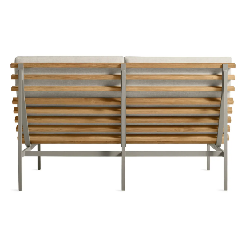 The Perch Outdoor 2 Seat Sofa from Blu Dot with charcoal frame and sunbrella linen upholstery form the back.