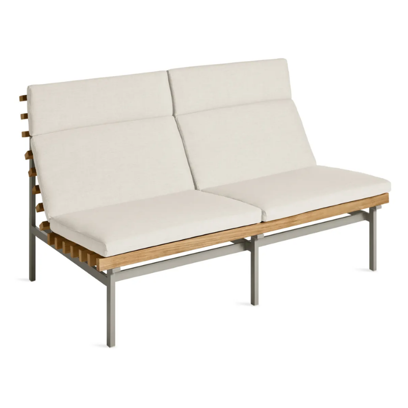 The Perch Outdoor 2 Seat Sofa from Blu Dot with charcoal frame and sunbrella linen upholstery from a high angle.