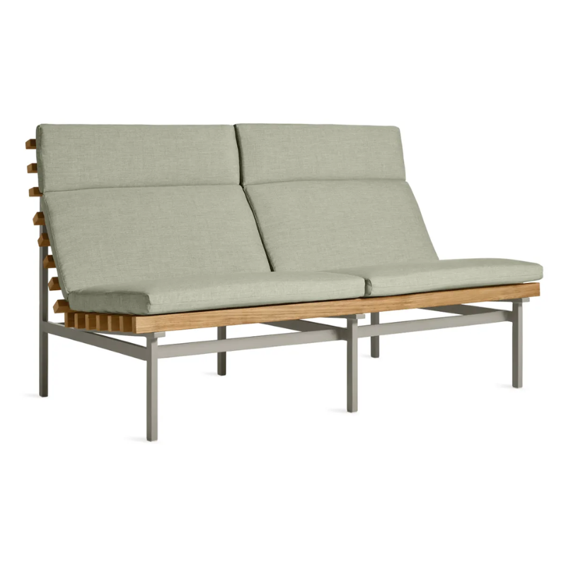 The Perch Outdoor 2 Seat Sofa from Blu Dot with carbon frame and sunbrella oasis upholstery from an angle.