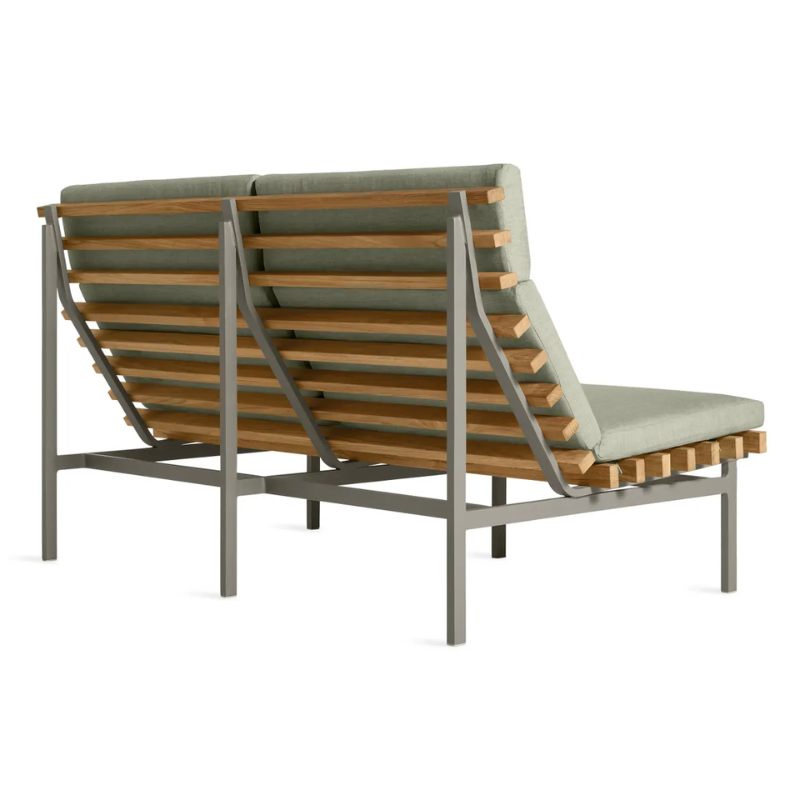 The Perch Outdoor 2 Seat Sofa from Blu Dot with carbon frame and sunbrella oasis upholstery from th eback at an angle.