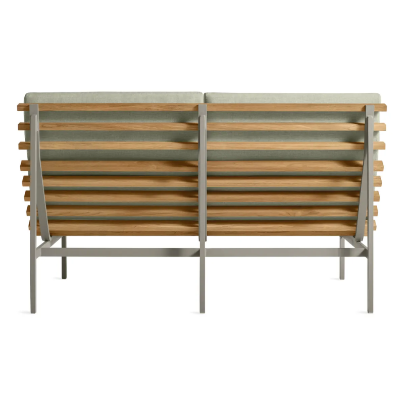 The Perch Outdoor 2 Seat Sofa from Blu Dot with carbon frame and sunbrella oasis upholstery from the back.