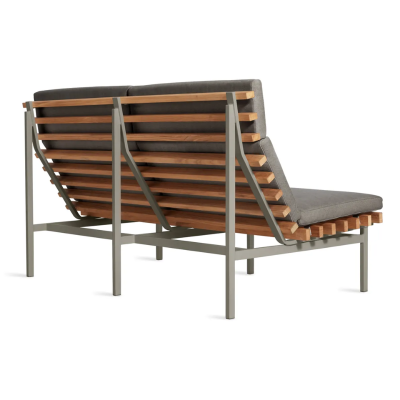 The Perch Outdoor 2 Seat Sofa from Blu Dot with carbon frame and toohey charcoal upholstery from the back at an angle.