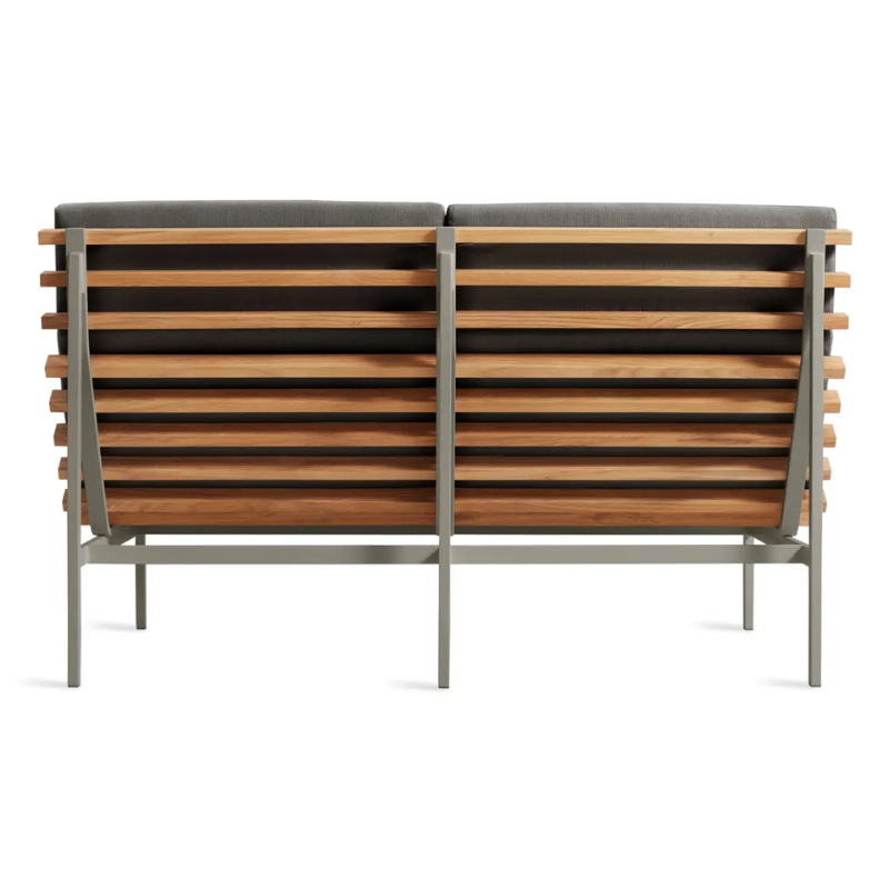 The Perch Outdoor 2 Seat Sofa from Blu Dot with carbon frame and toohey charcoal upholstery from the back.