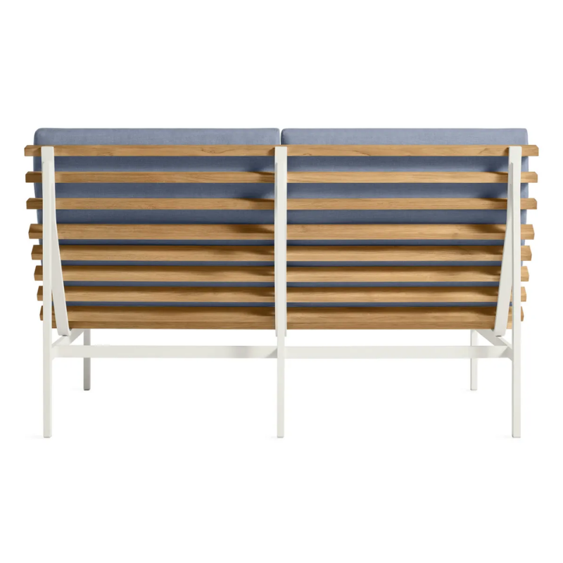 The Perch Outdoor 2 Seat Sofa from Blu Dot with white frame and sunbrella haze upholstery from the back.