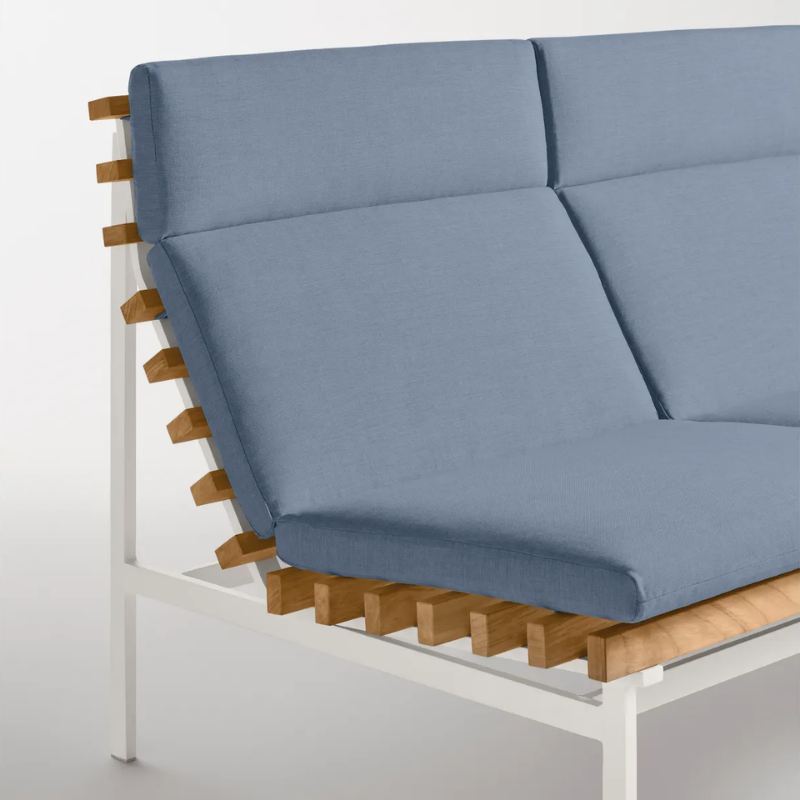 The Perch Outdoor 2 Seat Sofa from Blu Dot with white frame and sunbrella haze upholstery in a studio.