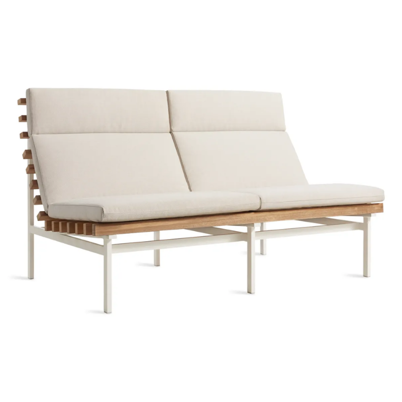 The Perch Outdoor 2 Seat Sofa from Blu Dot with white frame and sunbrella linen upholstery from an angle.