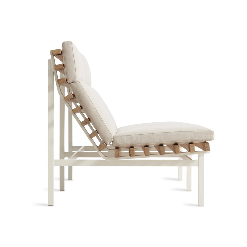 The Perch Outdoor 2 Seat Sofa from Blu Dot with white frame and sunbrella linen upholstery from the side.